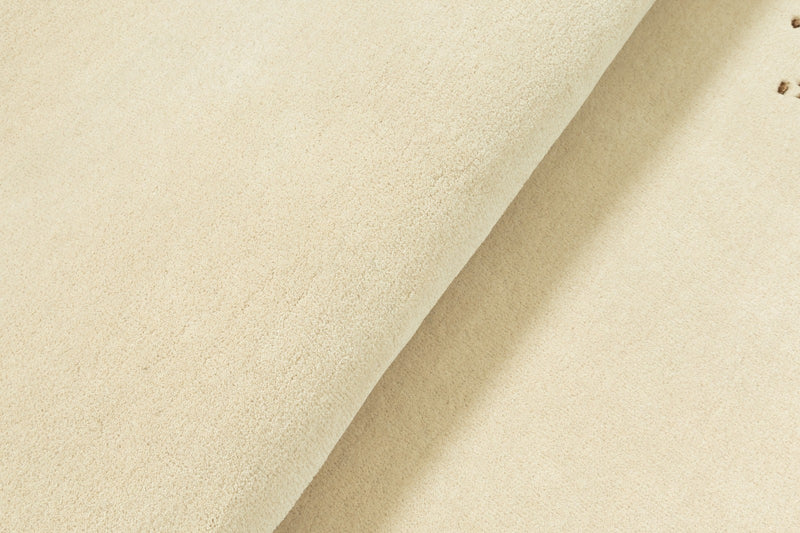 Tapis beige : polyvalence et raffinement pour votre décoration intérieure